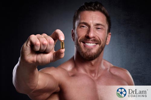 man holding adrenal fatigue supplements