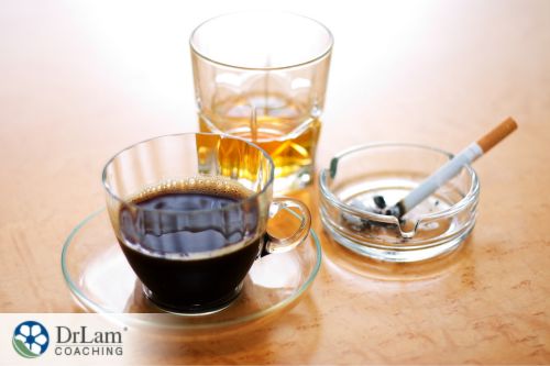 An image of a mug of coffee, cigarette, and alcohol